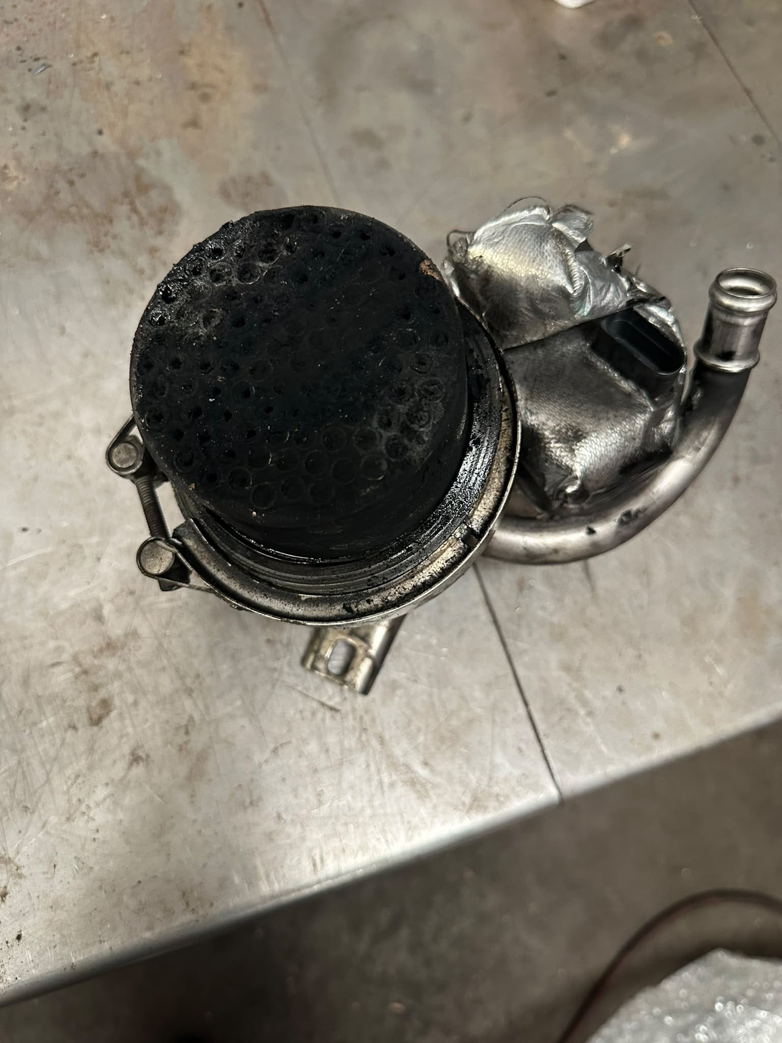 Blocked VW Audi diesel EGR component covered in carbon soot linked to fault code P200200